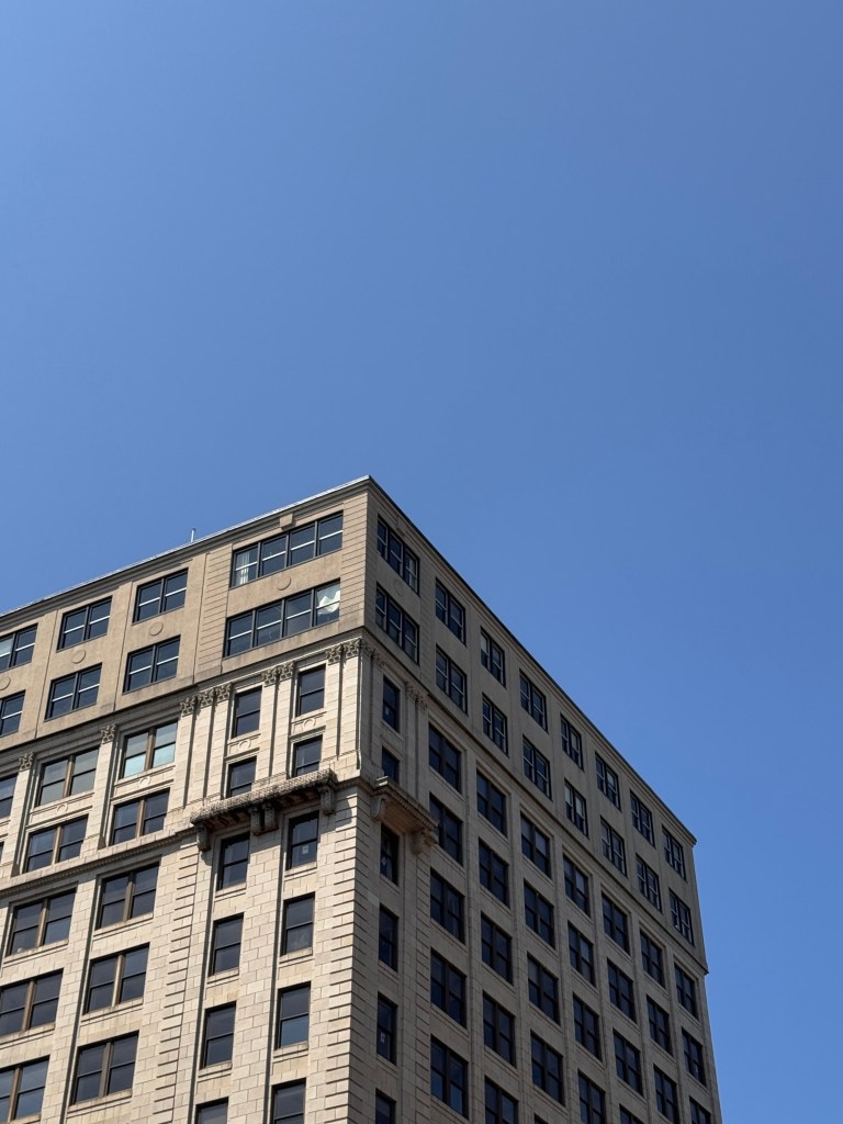Image of bright blue sky against a building 